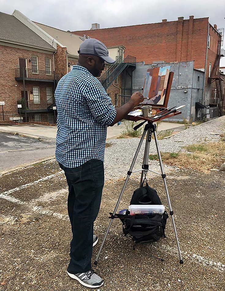 Painting "en plein air" outside an old building