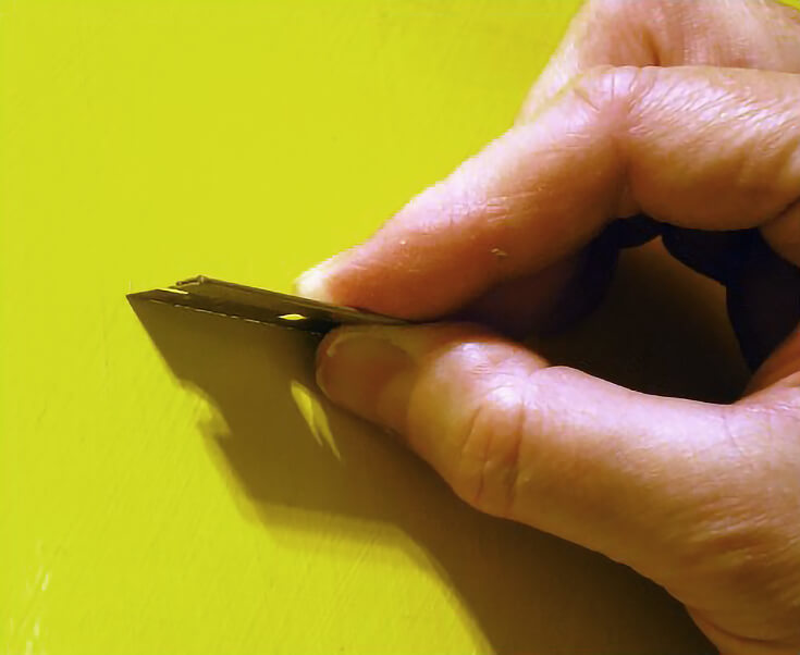 Proper technique for checking dryness of oil paint with a razor blade